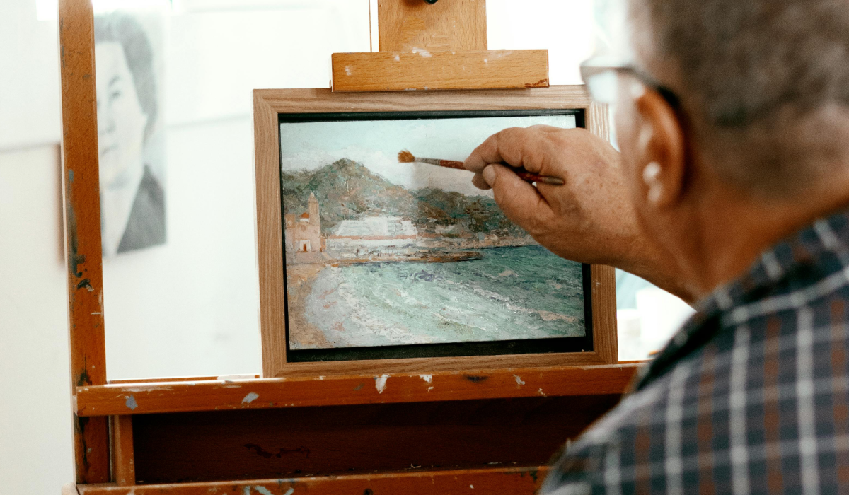 Person painitng a landscape 